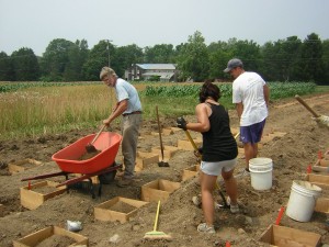 Filling the in-ground boxes with the amended soil.  