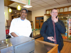 Rodney and Alex offer suggestions at the Mexican station.