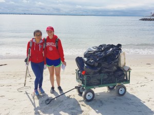 Two Cornell students, Sophia Robison (MRP, 2017) and Xiaoying Li (MLA, 2018) show off their trash pile at the end of the NYC H2O Plumb Beach Cleanup Day.