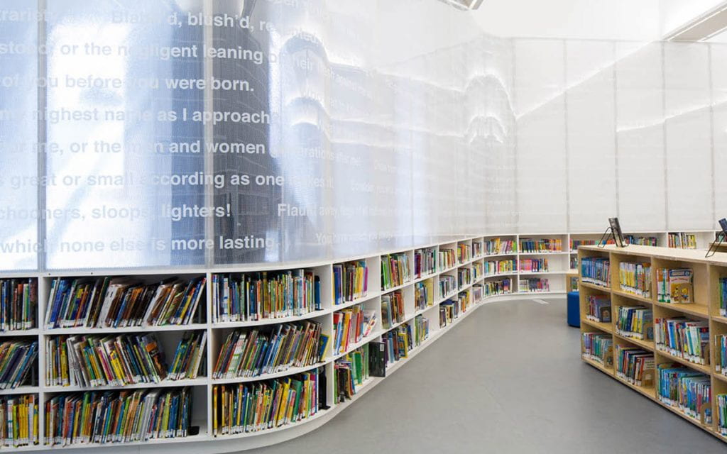 Curved stacks of library books