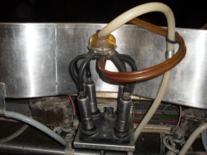 Milking machine with four suction cups.