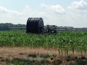 The massive reel that retracts the nutrient boom once it's detached from the tractor