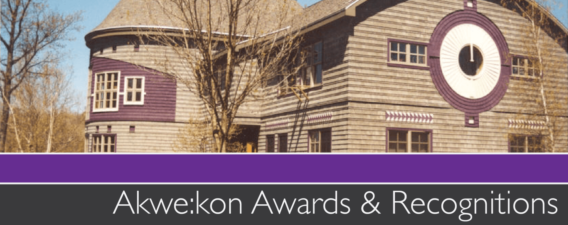 Banner with a picture of a large gray building with a circular window and text underneath which says Akwekon awards and recognitions.
