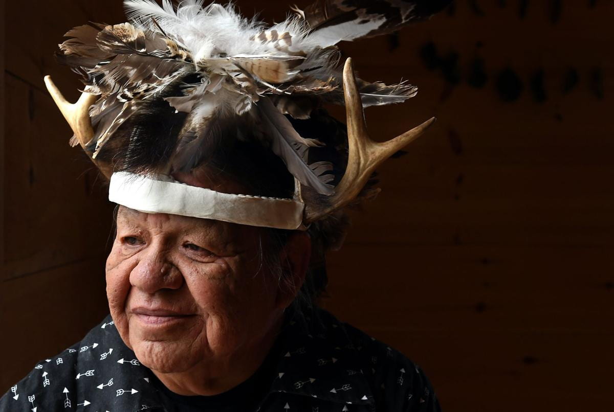 Headshot photo of a man wearing traditional Cayuga Nation headdress.