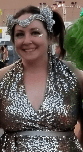 A woman in a sparkly outfit and headpiece