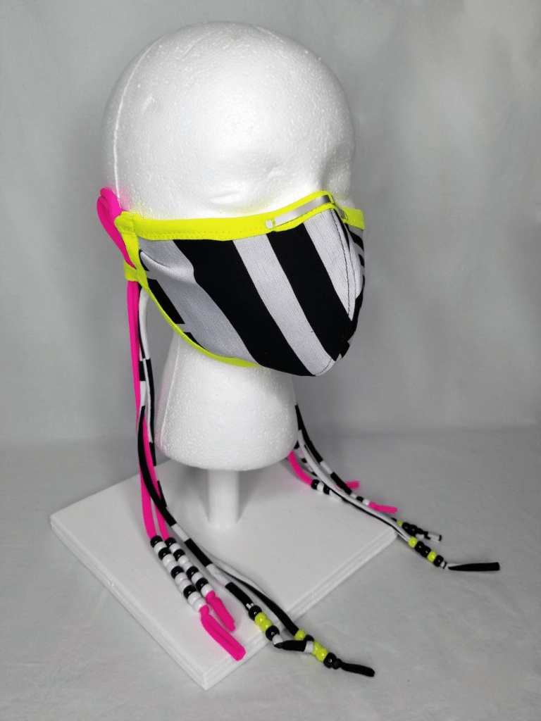 A striped face mask with beaded ties
