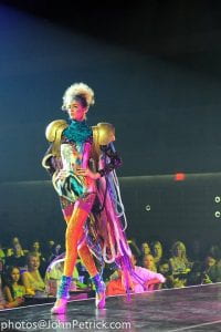 A woman in costume on a fashion runway