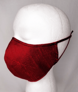 Side view of a red face mask