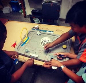 Children making a maker project