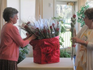 Nancy Richards and Madeleine Hemmings handing out roses for Activity Group Leaders