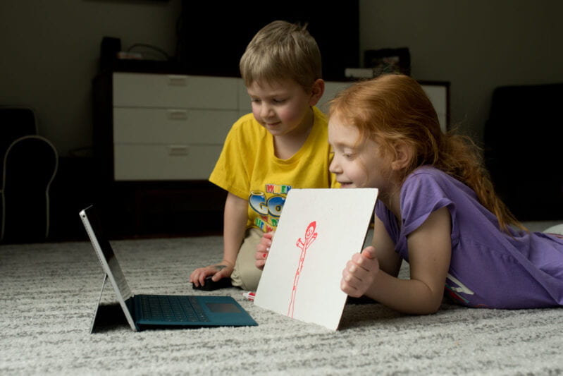 Kids showing drawing on Skype