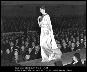 Eleanor Roosevelt walks down the runway in her inaugural ball gown during Farm & Home Week in 1937. She later donated the dress to the Cornell Costume and Textile Collection (#915). 