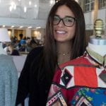 Allie Malakoff stands with patchwork dress form