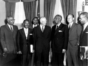 President Eisenhower poses in his office with civil rights leaders
