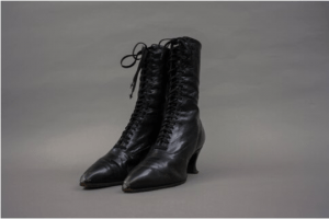 Black heeled boot. Leather. Laces up front. 