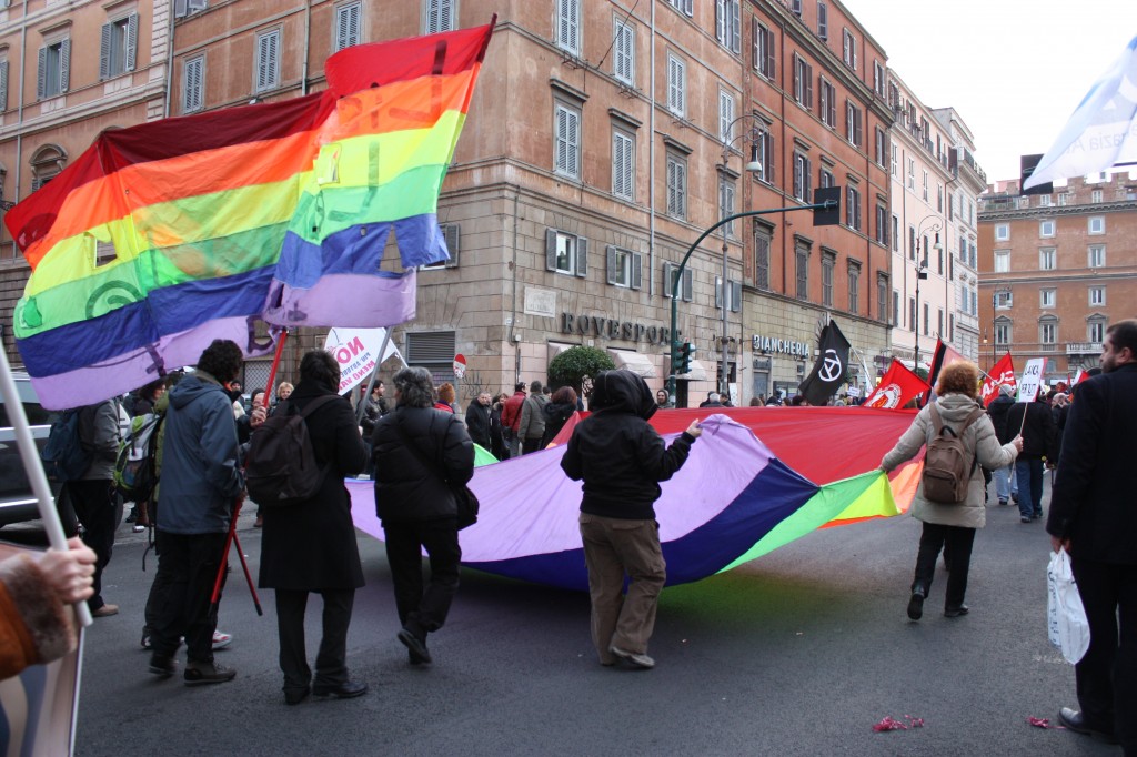 My new friend and others carrying the rainbow flag towards Largo Argentina.