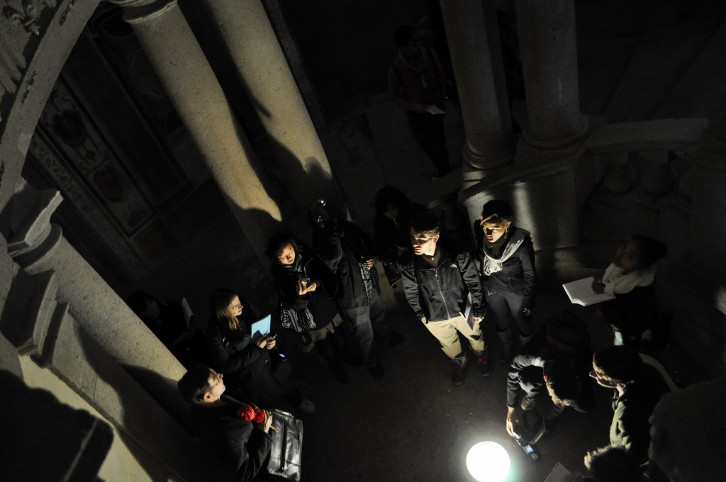 Students at the base of the circular staircase
