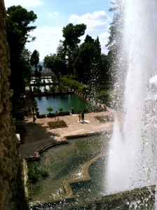 Behind the largest fountain