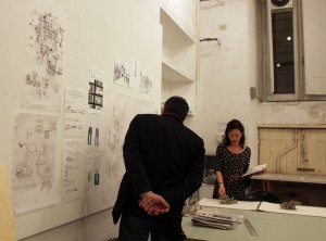 Dambruoso offers feedback as he wanders from desk to desk. Here, with Melody Stein, BFA 16'