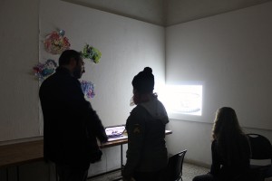 Dambruoso watches a video installation by Rachel Margolis, BFA 16'. Photo: Melody Stein 
