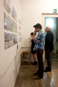 Visitors examine the work of the Intro to Photography class. Photo: Rina Kang