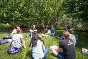 Dr. DeTar and Dr. Doyle leading a lunchtime roundtable discussion outside