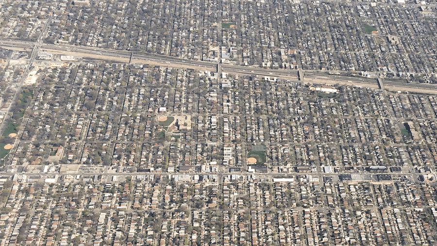 aerial view of neighborhood with houses and highways 