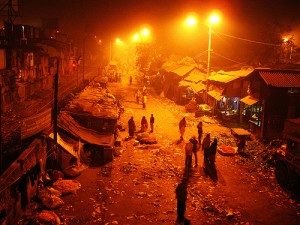 Streetlights and paved roadways in a Calcutta slum. Peter Scott, Flickr.