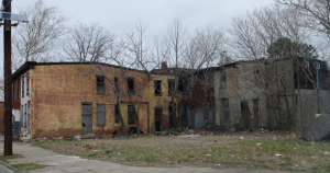 Figure 1. These abandoned homes in Camden, NJ are just minutes from the developed waterfront area. This illustrates the hardship of the city and the challenges in integrating the tourist areas into the residential areas. (Source: Associated Press Images)