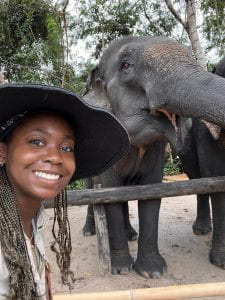 student with elephant