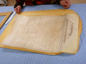 The document started to curl once it was lifted off the backing board.