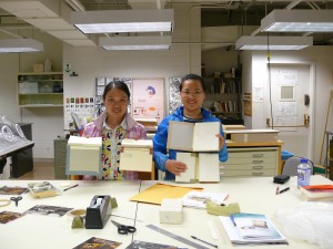 Zhimei (left) and Chunmei are holding their book models.