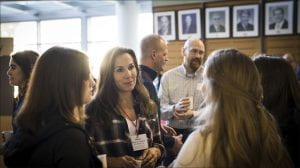 An alum discusses with students during the latest coffee and conversation event