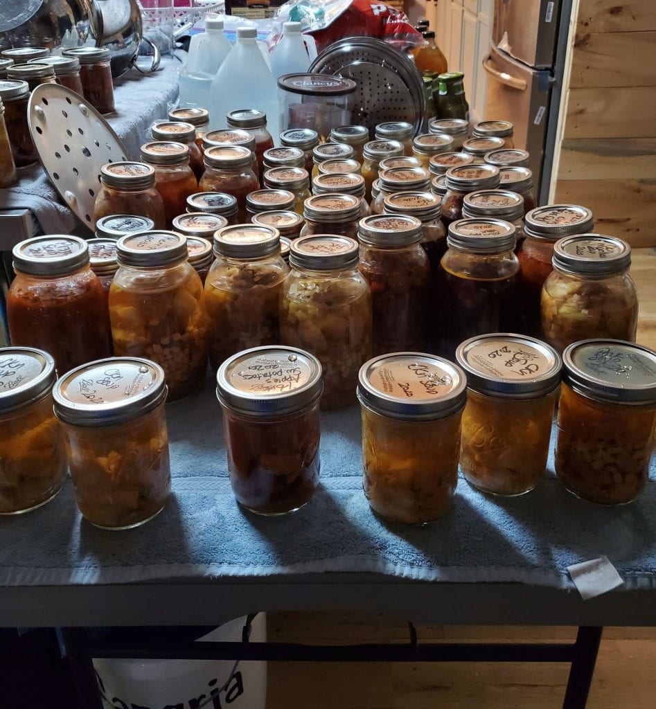 Many jars of canned soup.