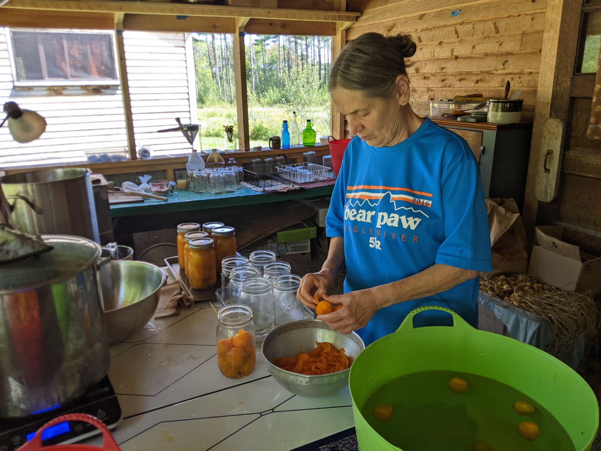 Carolyn preserves tomatoes