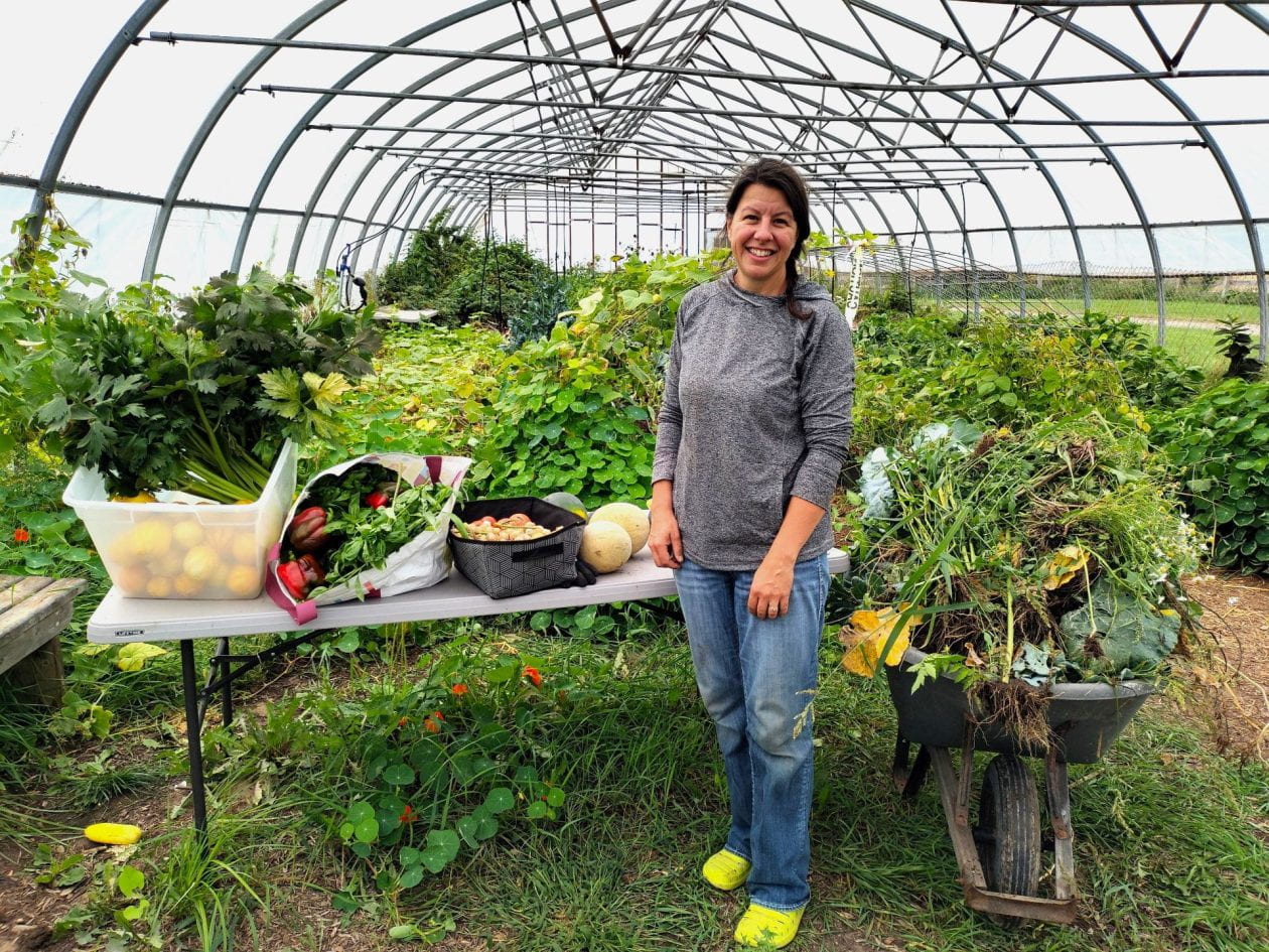 Sara Trimm with her harvest from the CCE high tunnel last fall.