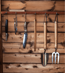 Handtools hanging neatly in garden shed