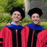 Picture of recent PhD graduates Andrew Hubble and Nazih Kassem at 2022 Cornell PhD Graduate ceremony