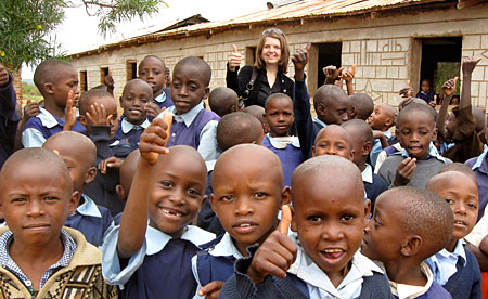 Caption:  Christine Hadekel with schoolchildren in Kitui, Kenya, summer 2010.