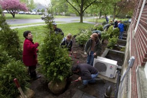 Nina Bassuk, left, oversees plantings in front of Hedrick Hall in Geneva as part of a final project by her Creating the Urban Eden class.  Photo by Rob Way.