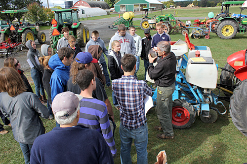 Farm manager Steve McKay explains planter seed plate selection.