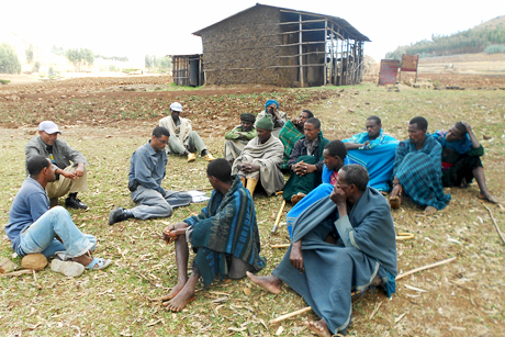 Semagn-Asredie Kolech, left-center, doctoral candidate in horticulture, poses with a group of Ethiopian farmers after surveying their practices.