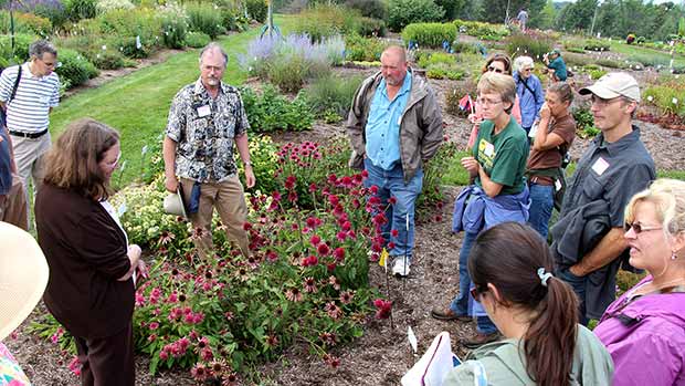 Plant pathologist Margery Daugherty and entomologist John Sanderson help attendees identify insect pests and diseases on perennials at Bluegrass Lane.