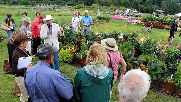Attendees view demonstration of mixed vegetable/ornamental container plantings. "For many, the garden of the future will be on their deck," Armitage told the group.
