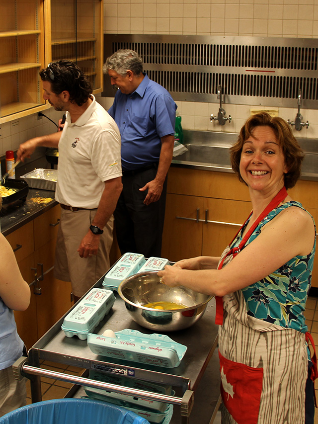 Frank Rossi, Marvin Pritts and Justine Vanden Heuvel cook up breakfast for Plant Science graduates and their families.