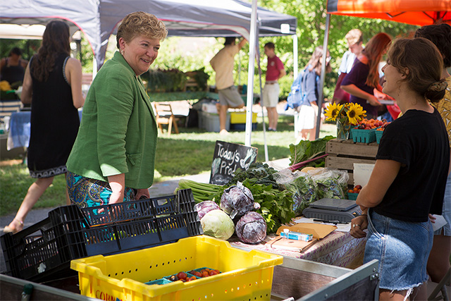 Kathryn Boor, the Ronald P. Lynch Dean of Agriculture and Life Sciences, stops by the Dilmun Hill farm stand during the Ag Quad Farmers Market, Sept. 1.