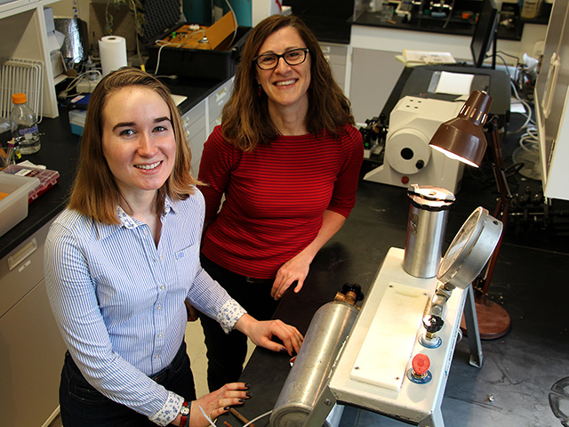 Bauerle (right) orients Plant Sciences major Tommi Schieder ’19 to equipment she used on her internship in Germany to collect data on the passive movement of water that helps trees survive drought stress.