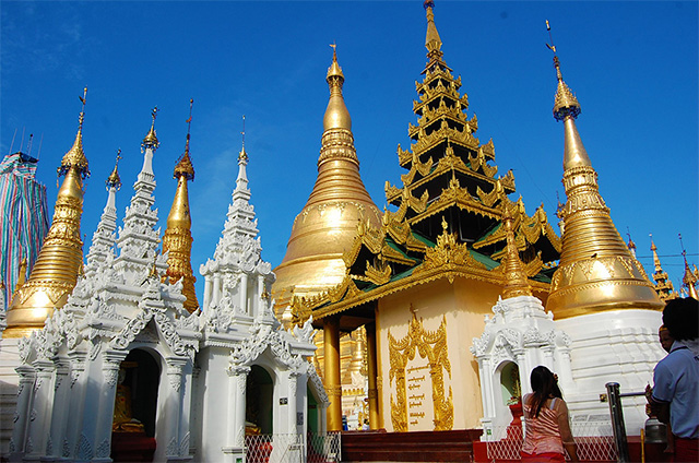 The Shwedagon Pagoda in Yangon which stands more than 300 feet tall and is covered with gold. 