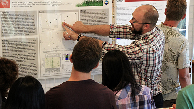 Ph.D. candidate Grant Thompson explains his research on soil bacterial communities in residential lawns during a poster session at the Fall 2017 Horticulture Graduate Field Review.