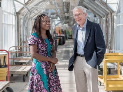 Kalenga Banda and professor emeritus Chris Wien, M.S. ‘67, Ph.D. ‘71 in the Kenneth Post Laboratory Greenhouse complex. Photo by Matt Hayes.